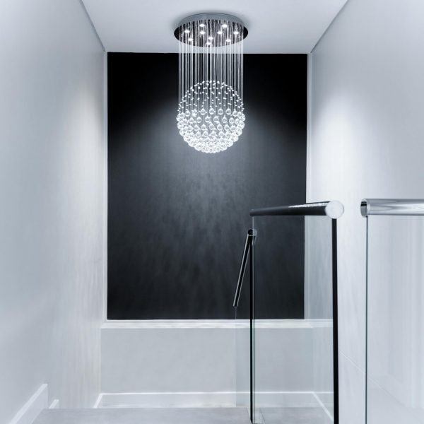Sleek contemporary hallway featuring a stunning glass chandelier and minimalist design.